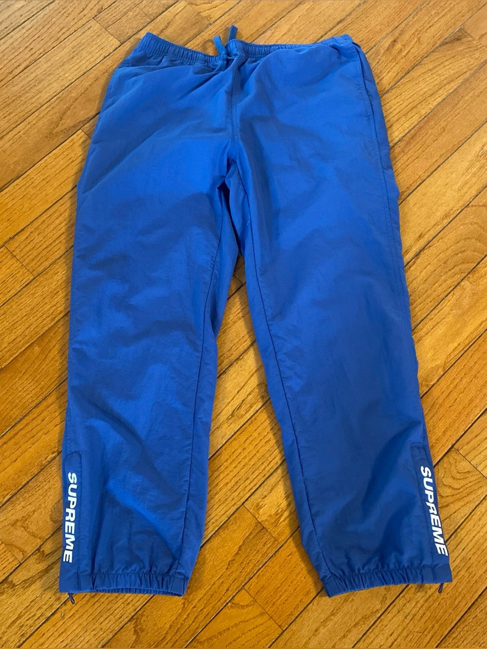 Supreme men’s warm up track pants blue size medium